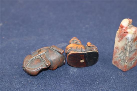 Two Japanese carved wood netsuke and a Chinese soapstone seal